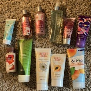 A variety of unused lotions, face scrubs, shower gels, and body sprays.